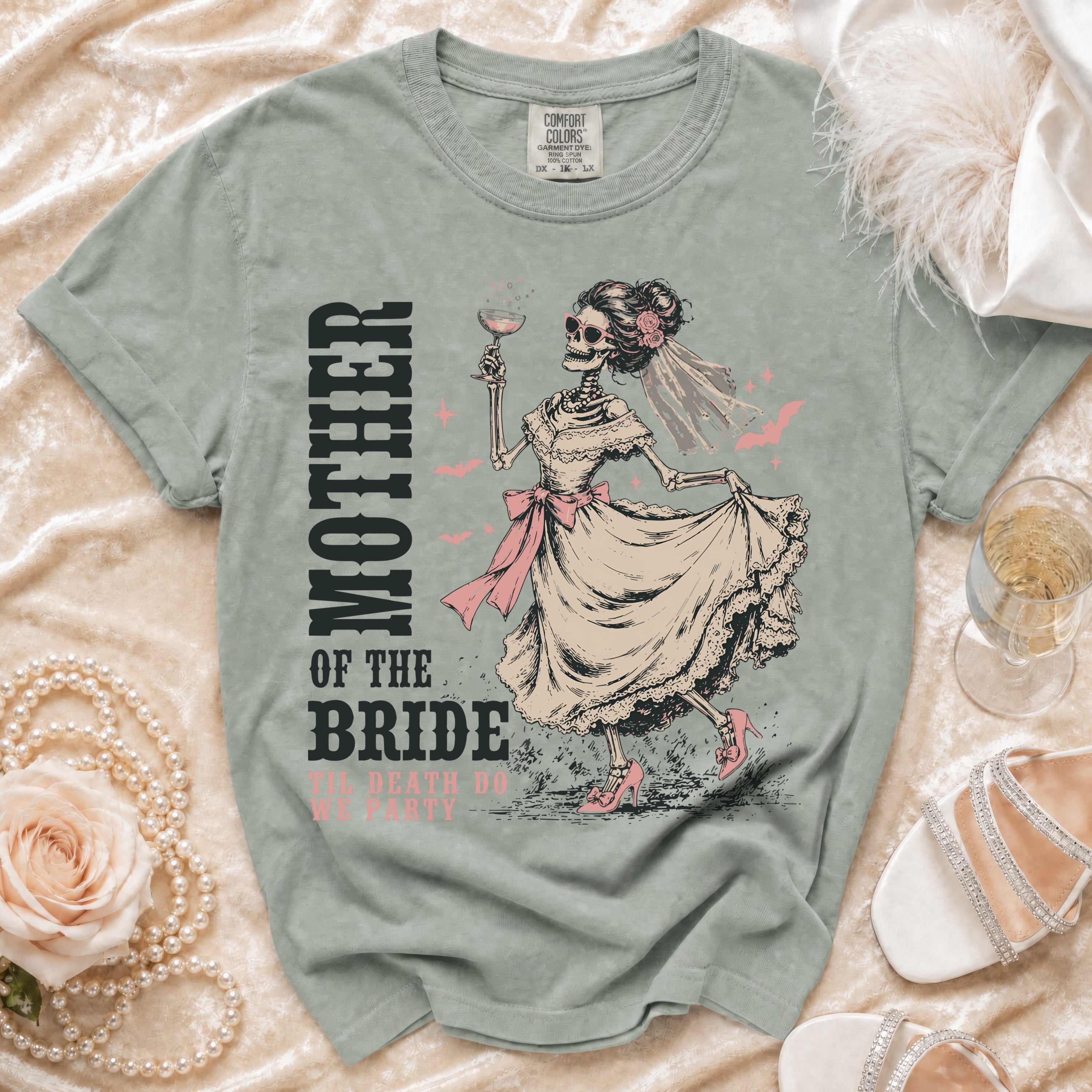 Skeleton bride graphic t-shirt with "Mother of the Bride" and "Til Death Do We Party" text.