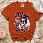 Orange t-shirt with skeleton bride graphic, holding a margarita, text "THIS GIRL NEEDS A MARGARITA".