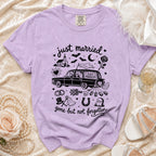 Purple t-shirt with "just married" text, skeleton couple in a car, and wedding/gothic elements.