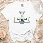 White t-shirt with "Married to Win" text and wedding rings in a trophy.