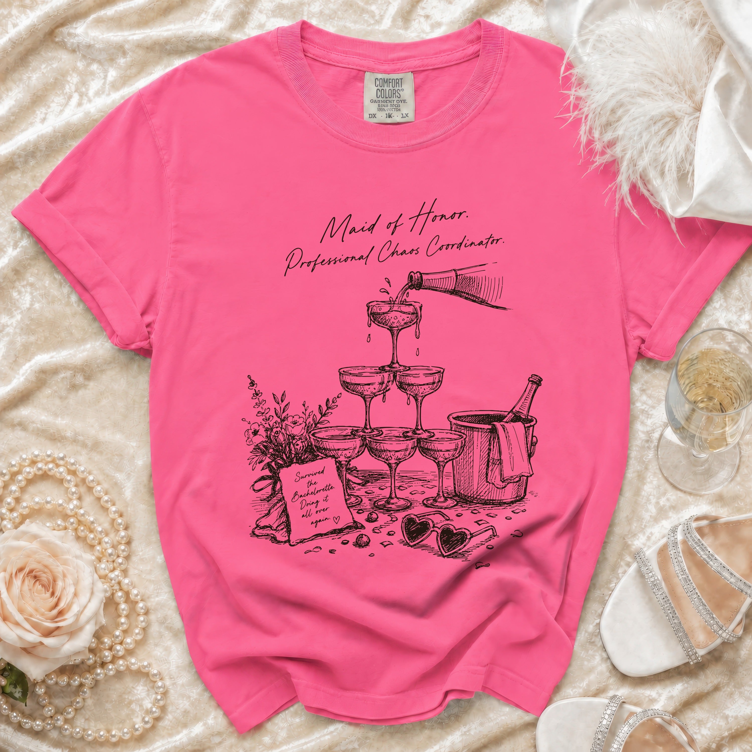 Pink t-shirt with "Maid of Honor. Professional Chaos Coordinator." text and sketch.