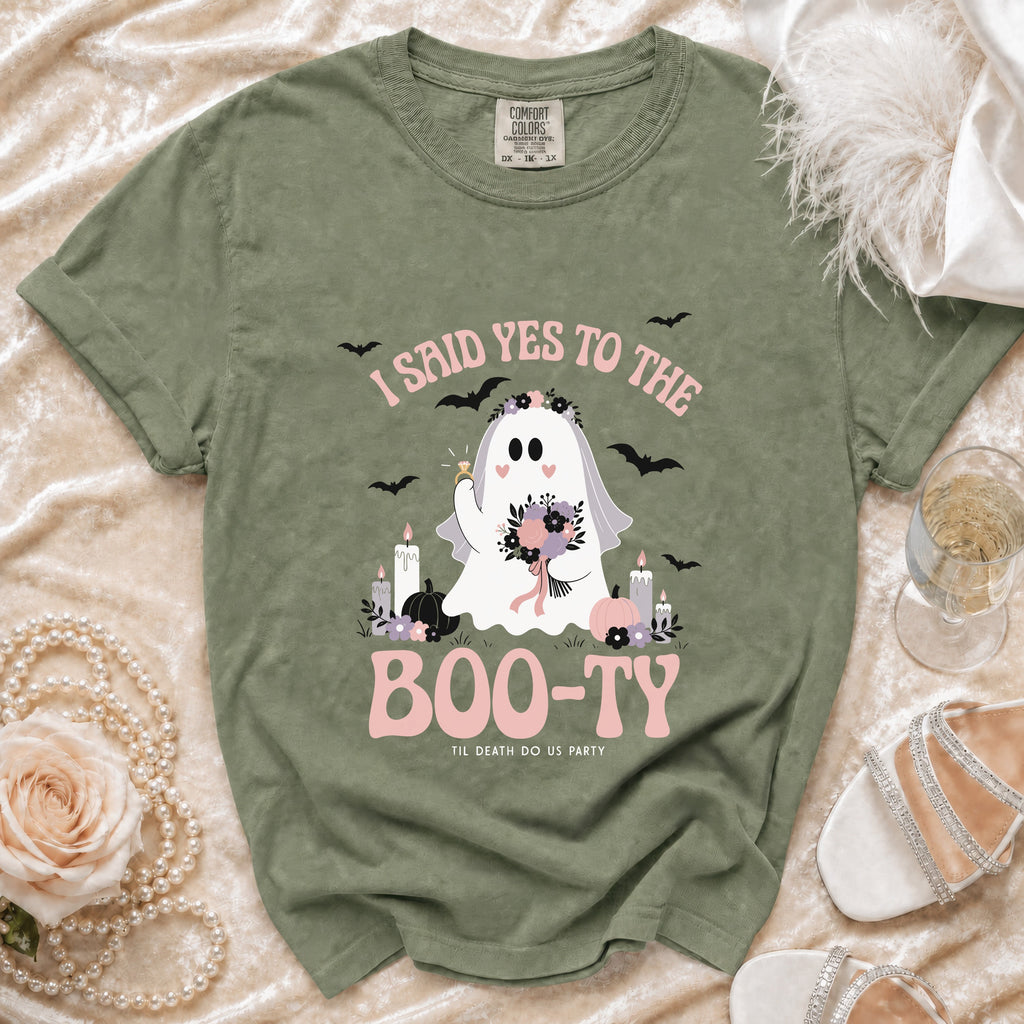 Green t-shirt with ghost bride graphic saying "I said yes to the Boo-ty".