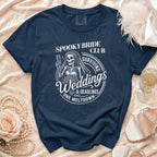 Navy t-shirt with "Spooky Bride Club Surviving Weddings & Deadlines One Meltdown" text and skeleton bride graphic.