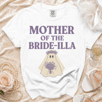 White t-shirt with "MOTHER OF THE BRIDE-ILLA" text and ghost graphic.