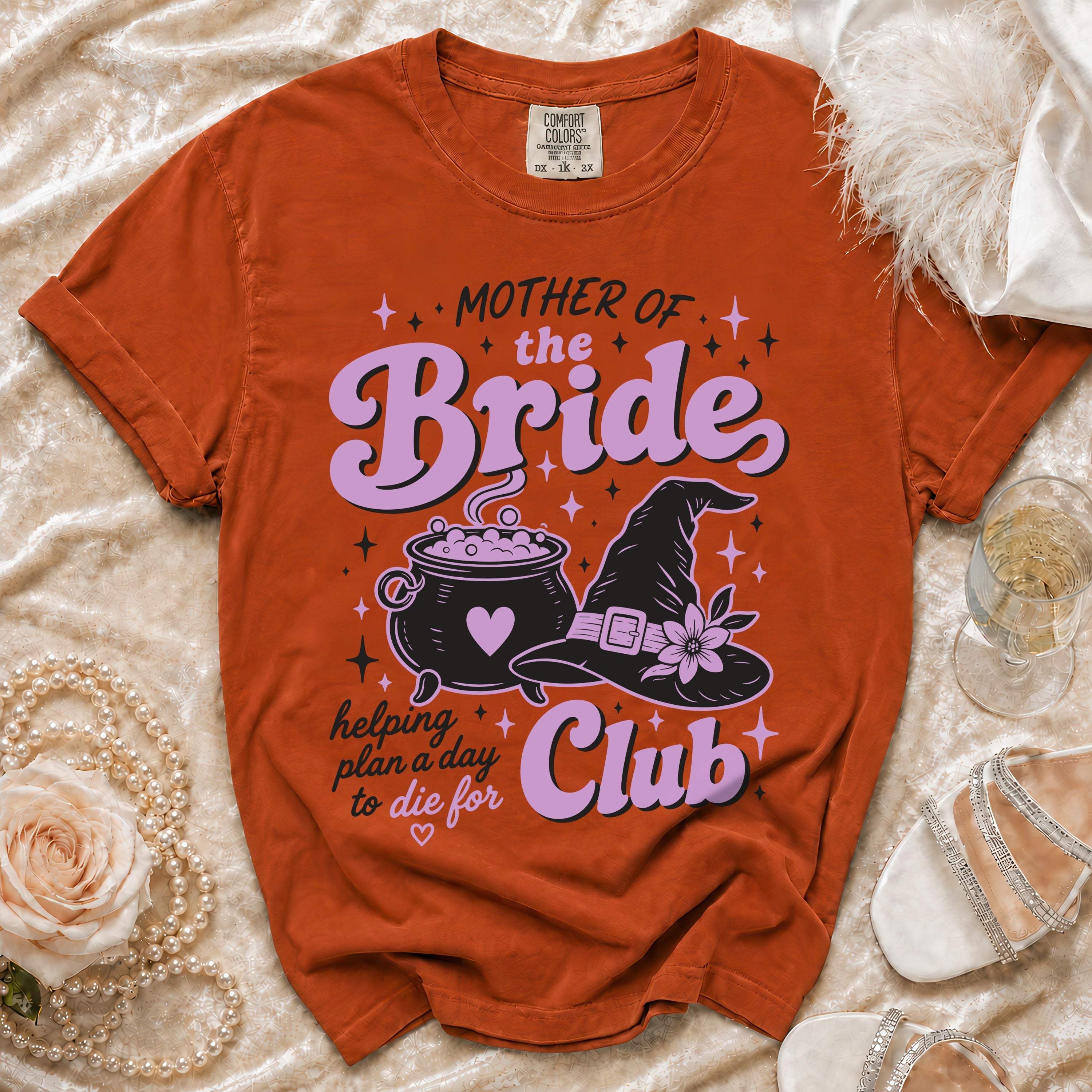 Orange t-shirt with "Mother of the Bride Club" text and witchy graphics.