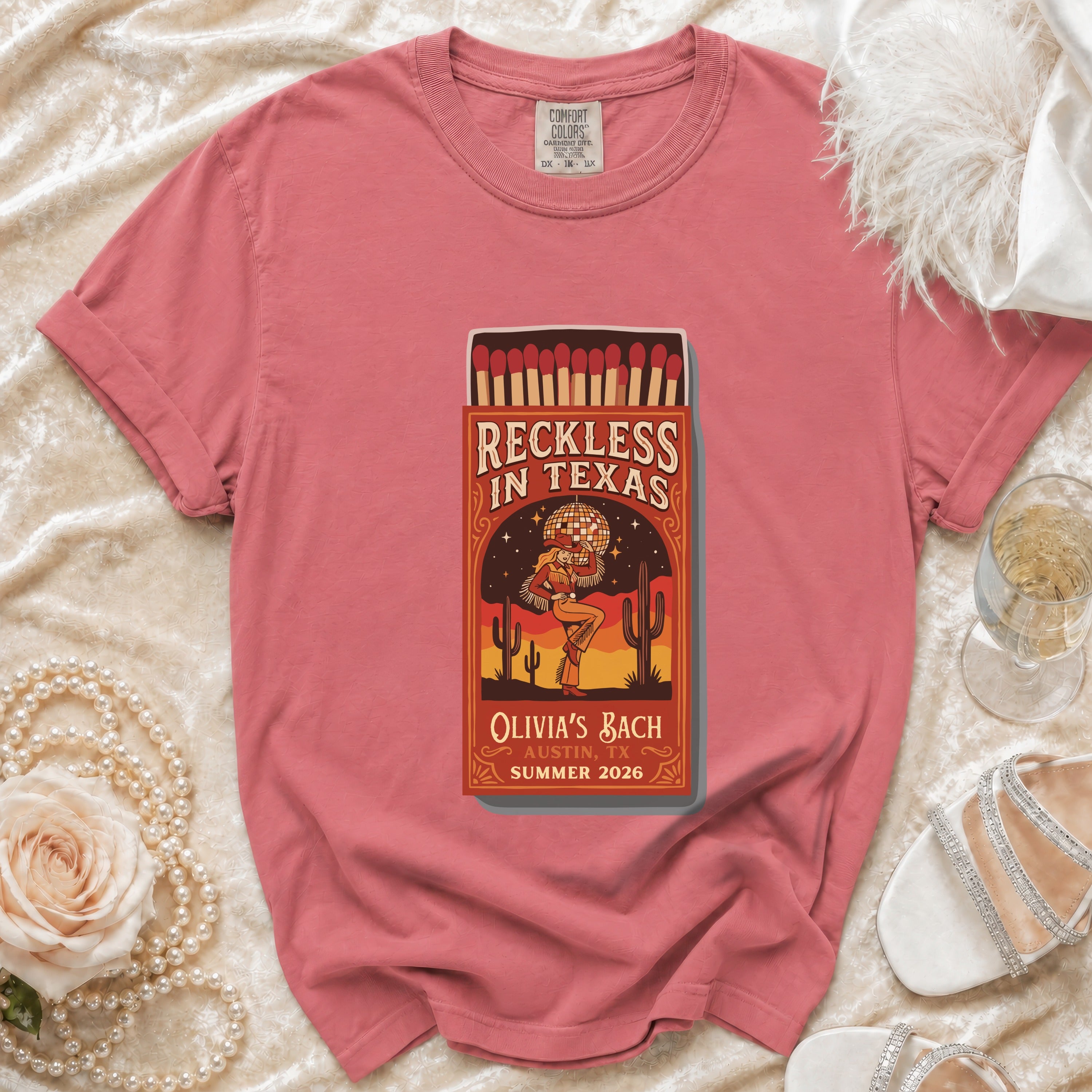 T-shirt with "Reckless in Texas Olivia's Bach Austin, TX Summer 2026" design.