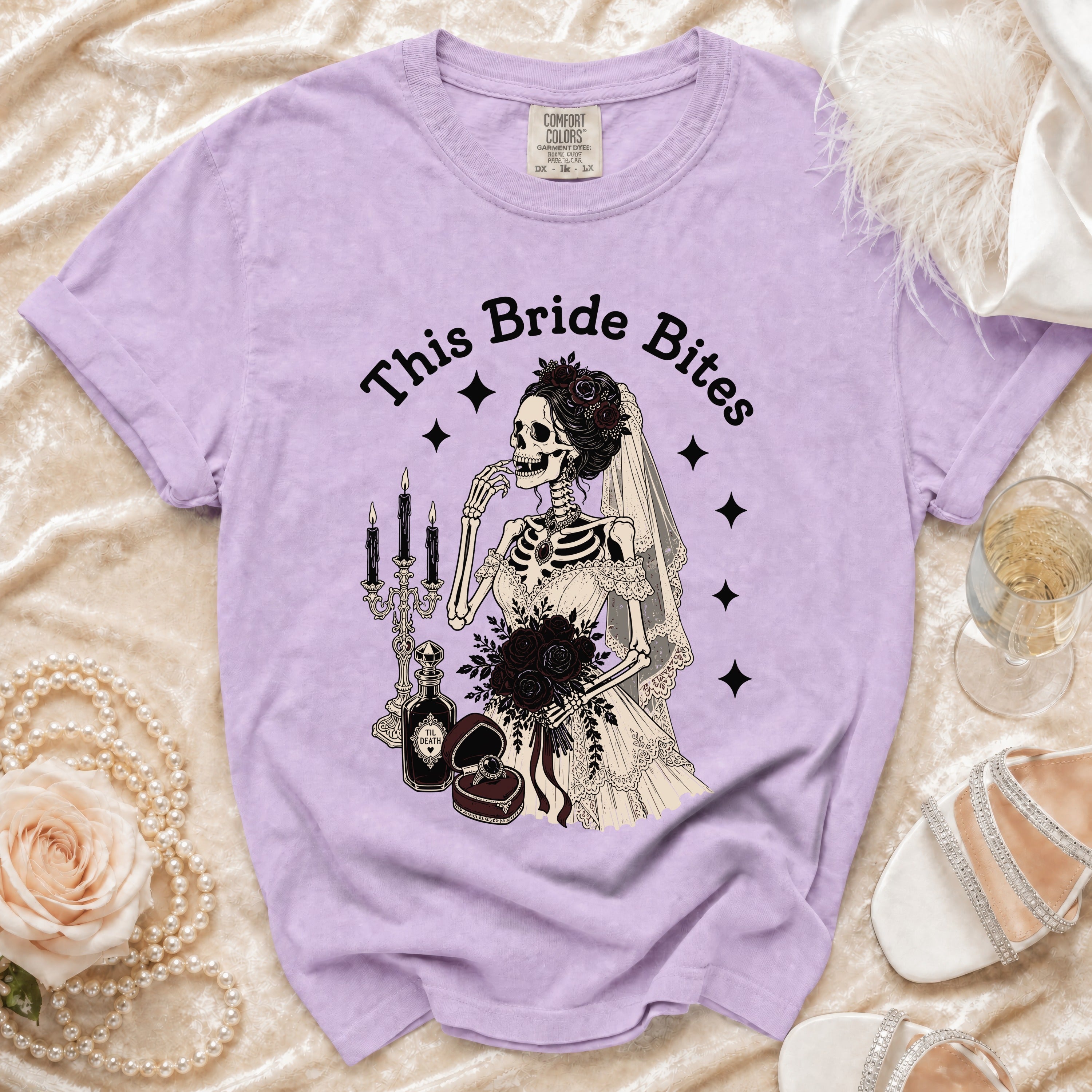 T-shirt with skeleton bride graphic and text "This Bride Bites".