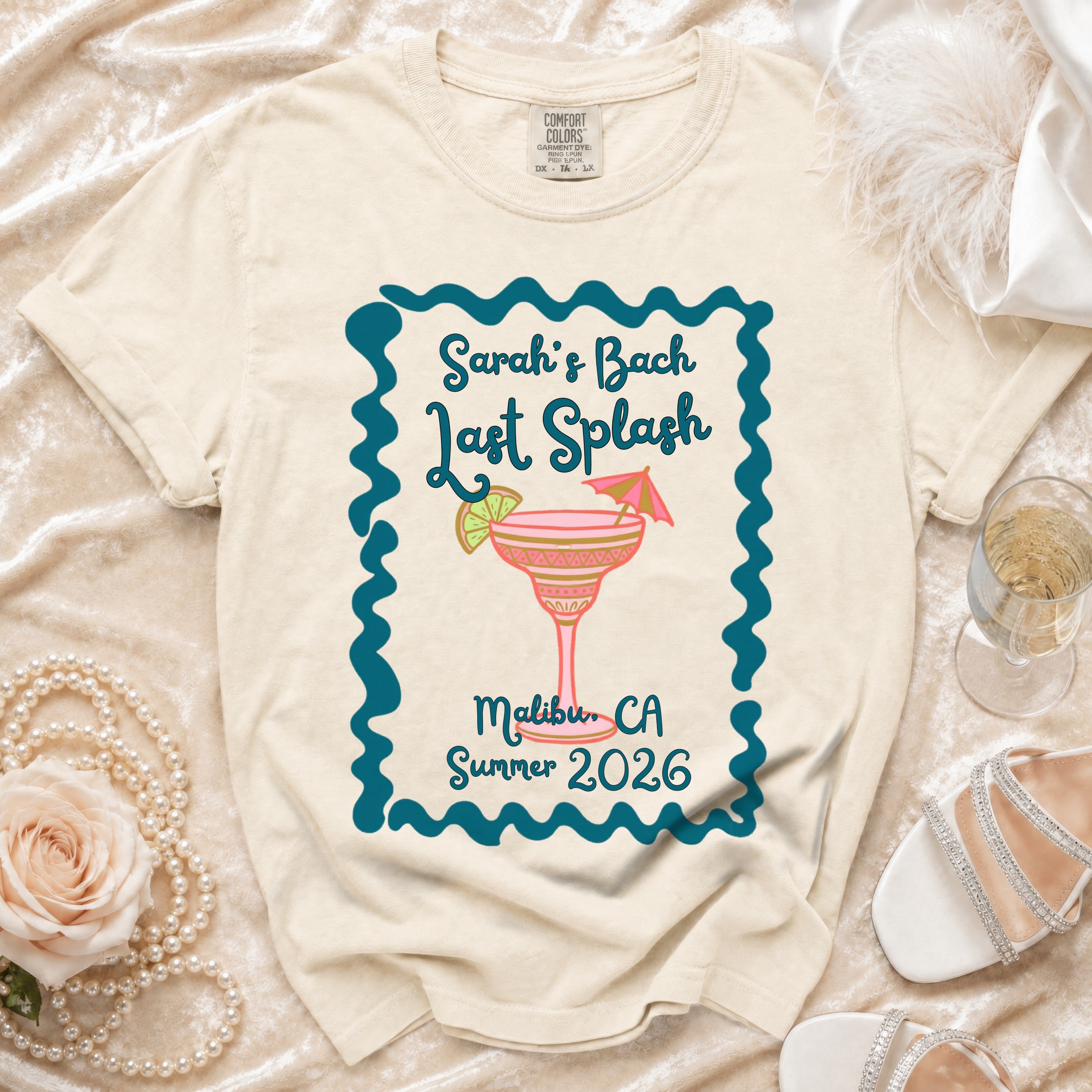 Cream t-shirt with "Sarah's Bach Last Splash Malibu, CA Summer 2026" and a pink martini.