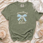 Olive green t-shirt with "something blue" text, blue bow, and wedding rings graphic.