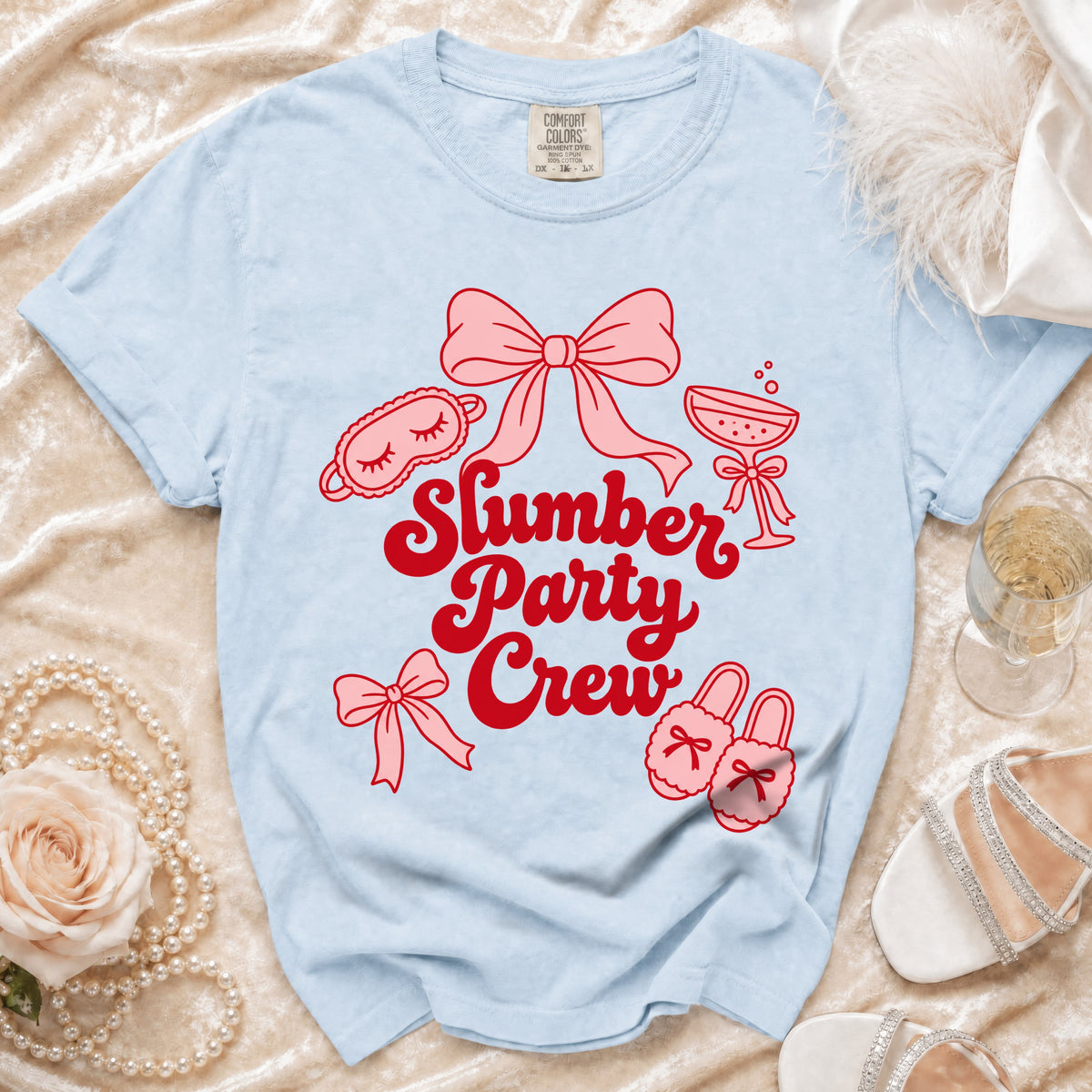 Light blue t-shirt with "Slumber Party Crew" text and slumber party icons.