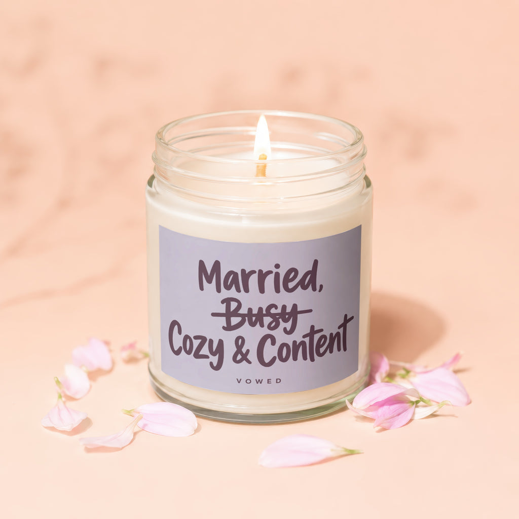 Candle with text "Married, Busy Cozy & Content" and "Vowed".