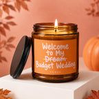 Candle labeled "Welcome to My Dream Budget Wedding - Vowed" with a lit wick.