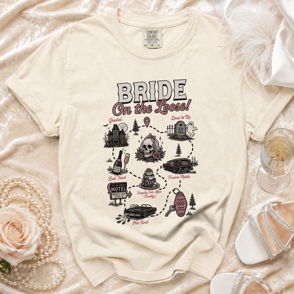 Cream t-shirt with "Bride on the Loose!" graphic depicting a story of spooky events.