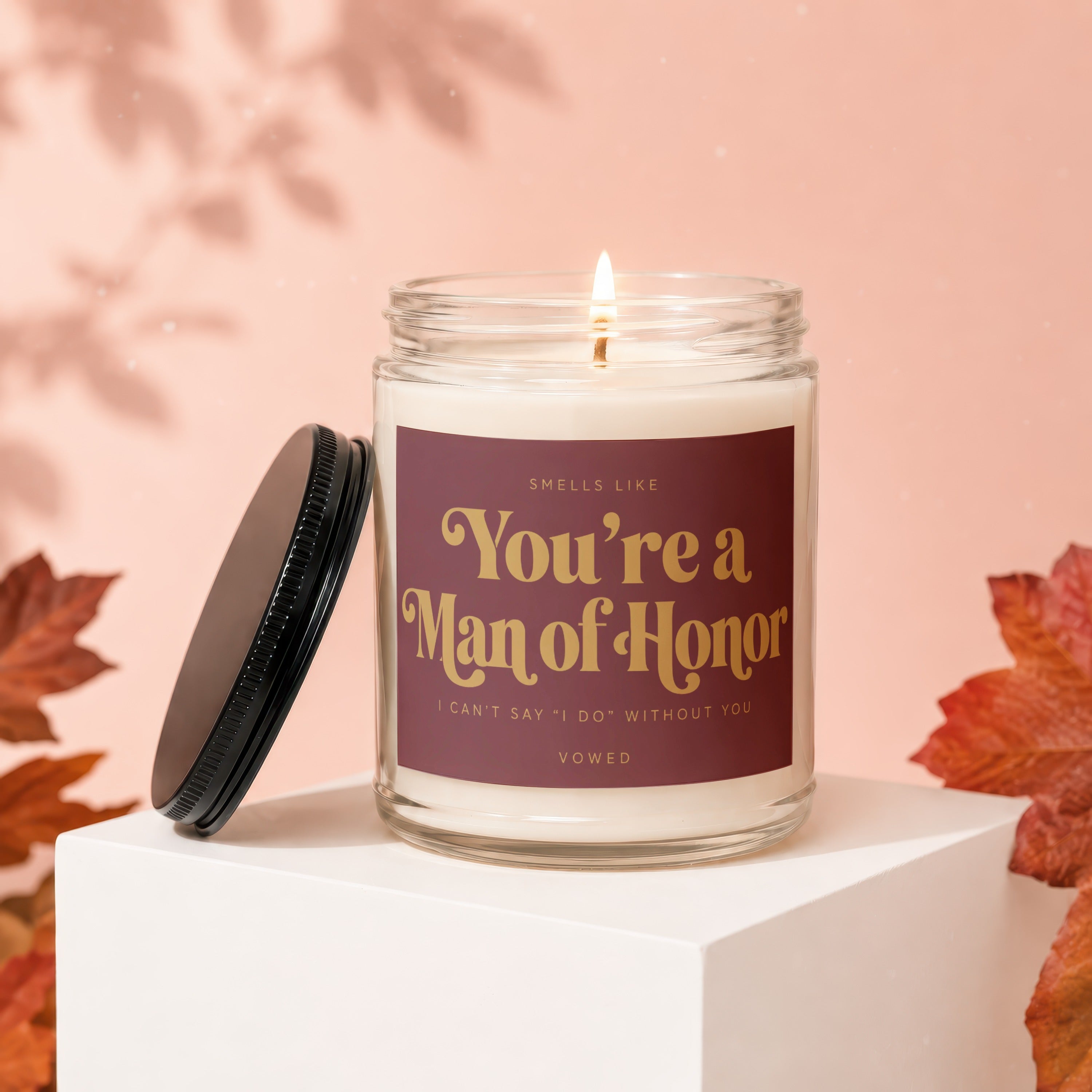 Jar candle with "You're a Man of Honor" text, lid removed.