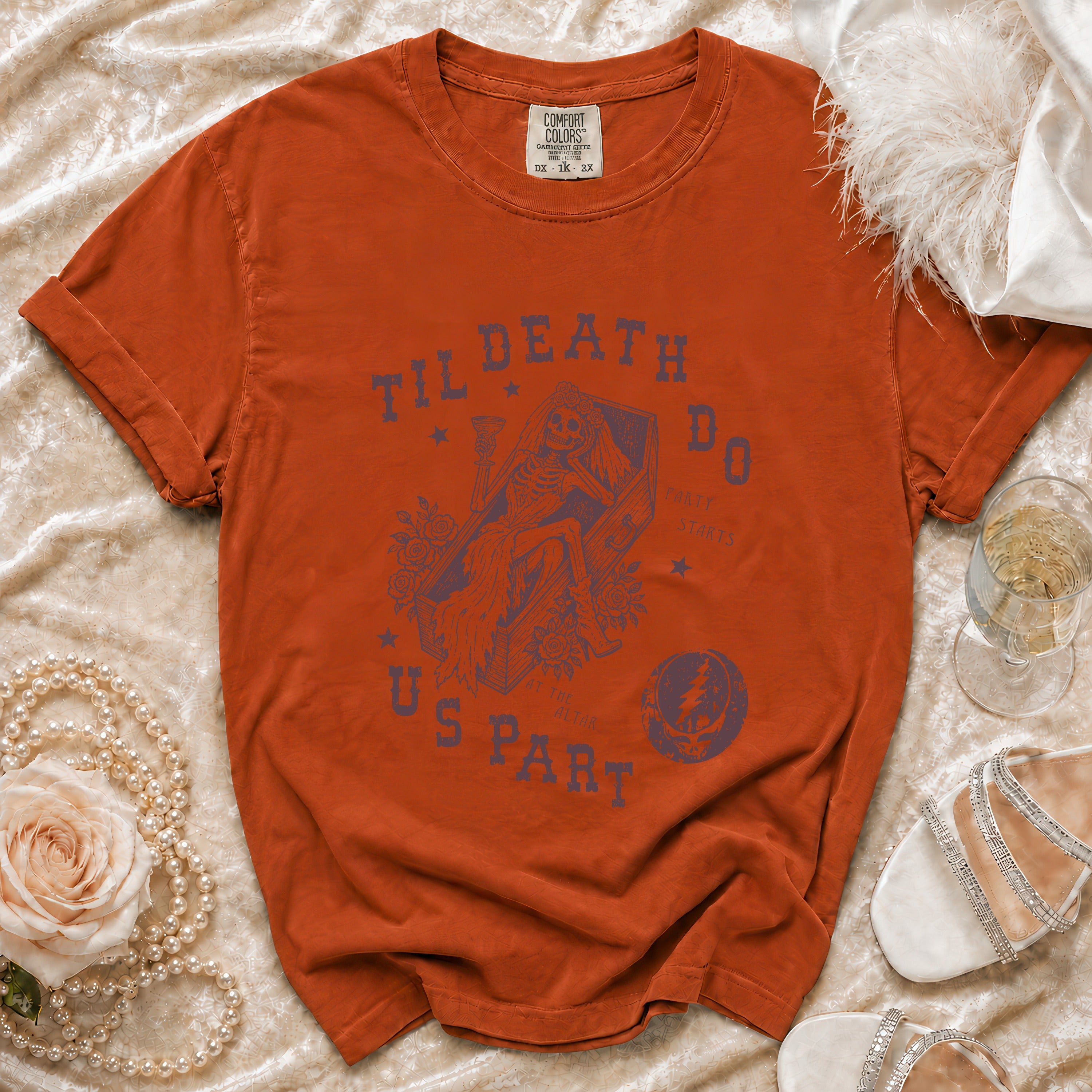 Orange t-shirt with "Til Death Do Us Part" graphic featuring a skeleton bride in a coffin.