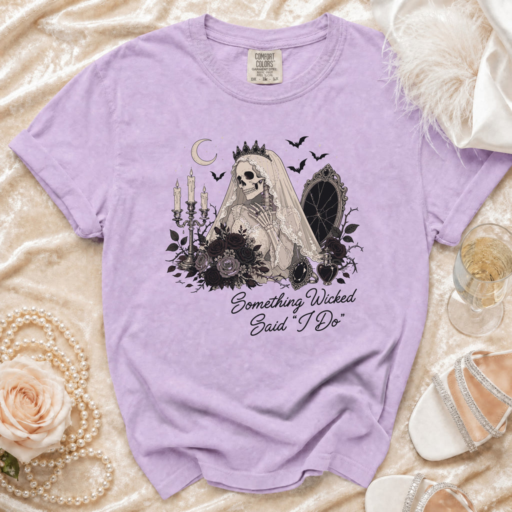 Lavender Comfort Colors shirt with gothic bride skeleton graphic and text "Something Wicked Said 'I Do'".