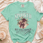 Mint green t-shirt: "Mother of the Bride Spooked But Still Booked" graphic.