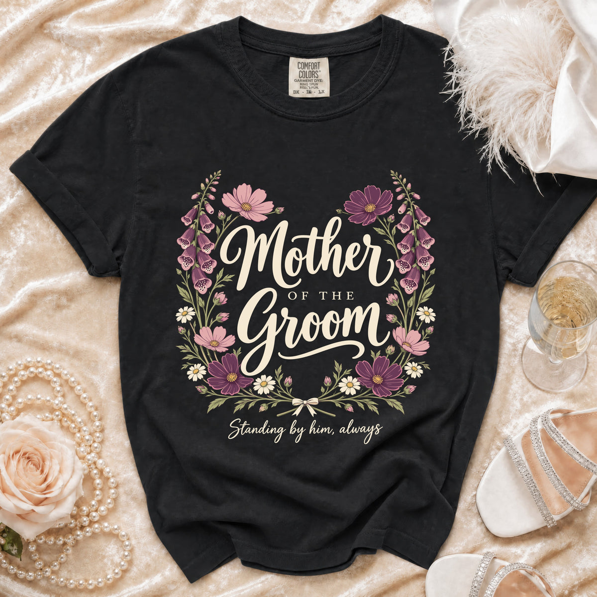 Black t-shirt with floral wreath and text "Mother of the Groom Standing by him, always".