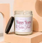 Glass jar candle with "Happy Tears & Sore Feet VOWED" on label.