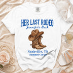 White t-shirt with "Her Last Rodeo" and cowboy boots graphic.