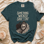 Teal t-shirt with "Something Wicked Said I Do" text and skull in a mirror.