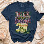 Navy t-shirt with "THIS GIRL NEEDS A SPICY MARG" graphic and margarita illustration.