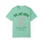 Green t-shirt with pink text "Her Last Rodeo" and cowboy boot graphic.
