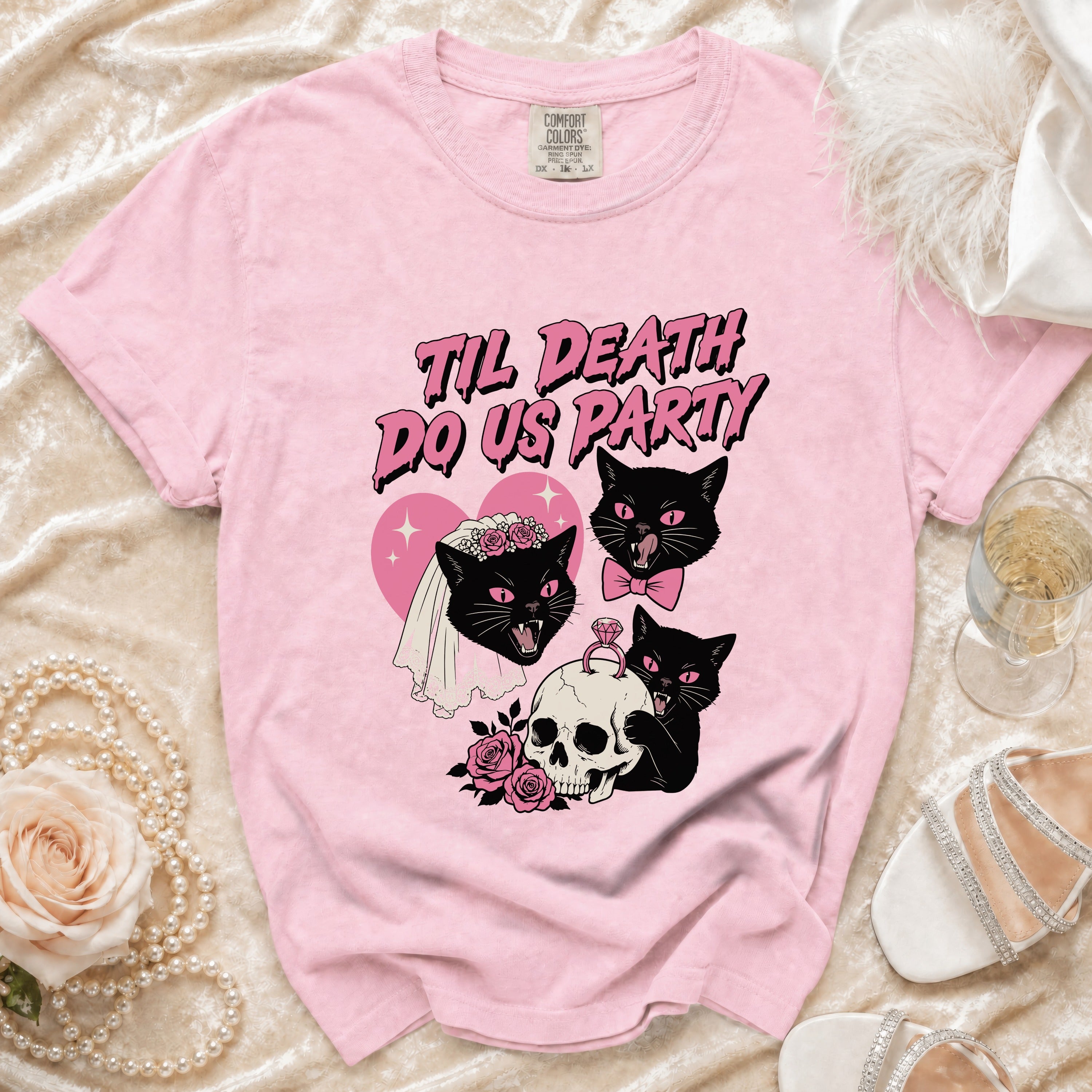 Pink t-shirt with black cats, skull, and text "Til Death Do Us Party".