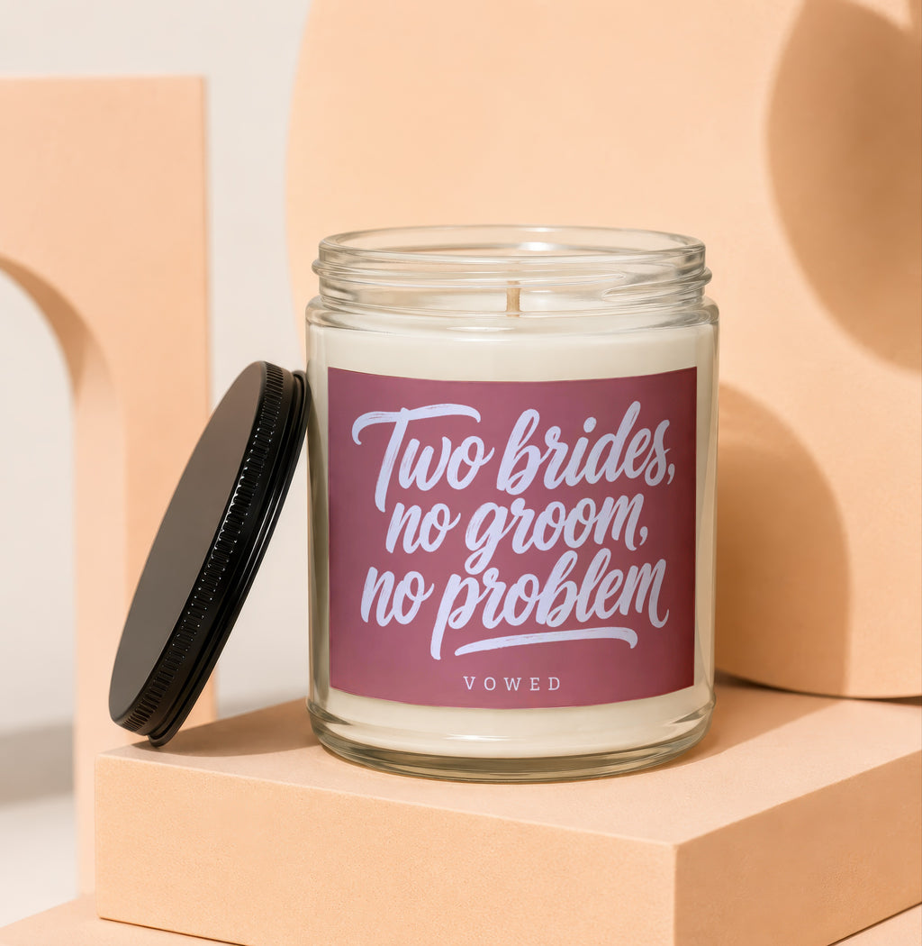 Candle with text "Two brides, no groom, no problem" and "VOWED".