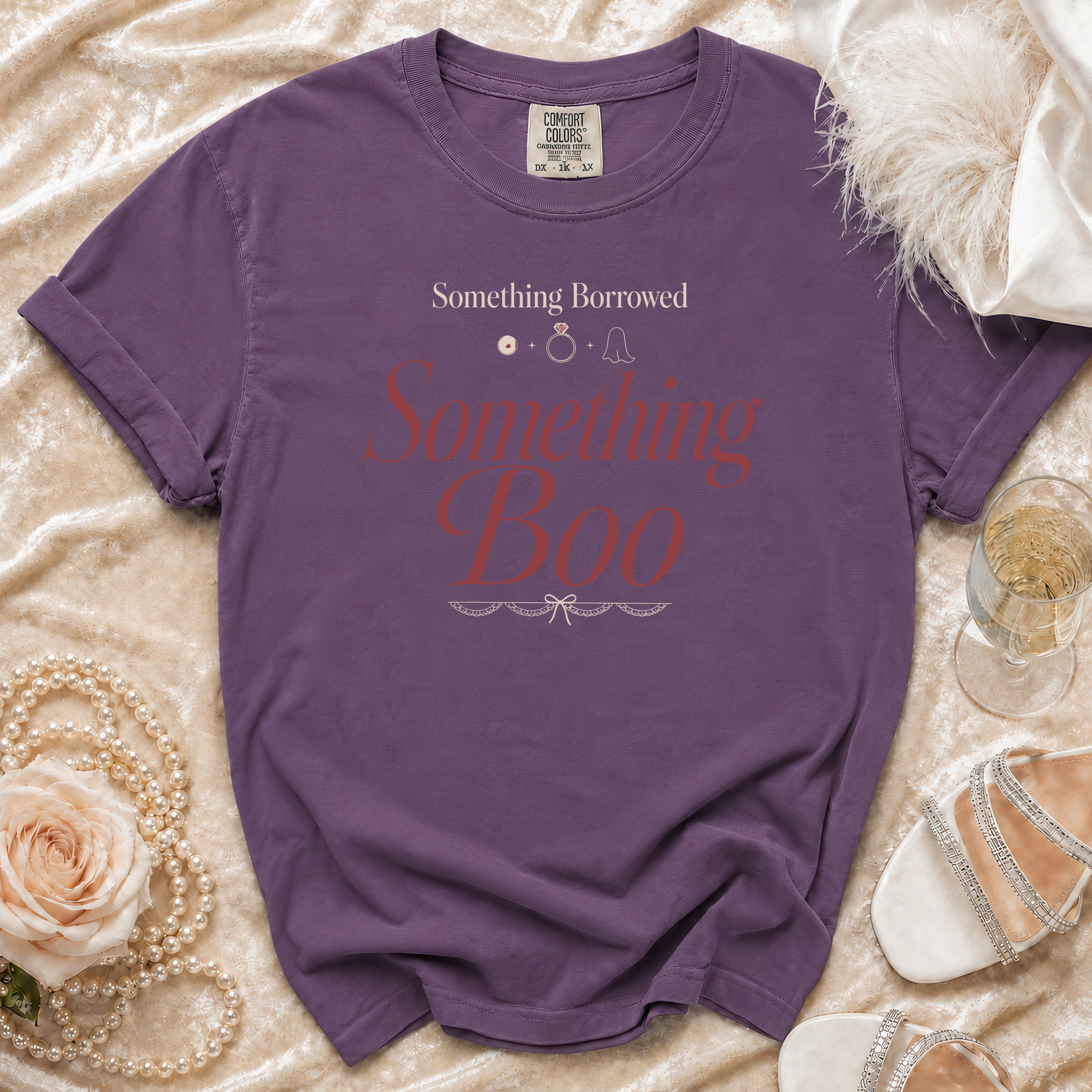 Purple t-shirt with "Something Borrowed Something Boo" text and wedding icons.
