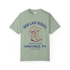 Green t-shirt with "Her Last Rodeo" and cowboy boots graphic.
