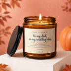 Amber jar candle with "To my dad, on my wedding day" message and autumn decor.