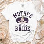 White t-shirt with "Mother of the Bride" and a witch hat graphic.