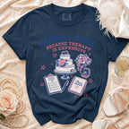 Navy t-shirt with "Wedding Planner Because Therapy Is Expensive" graphic and wedding imagery.