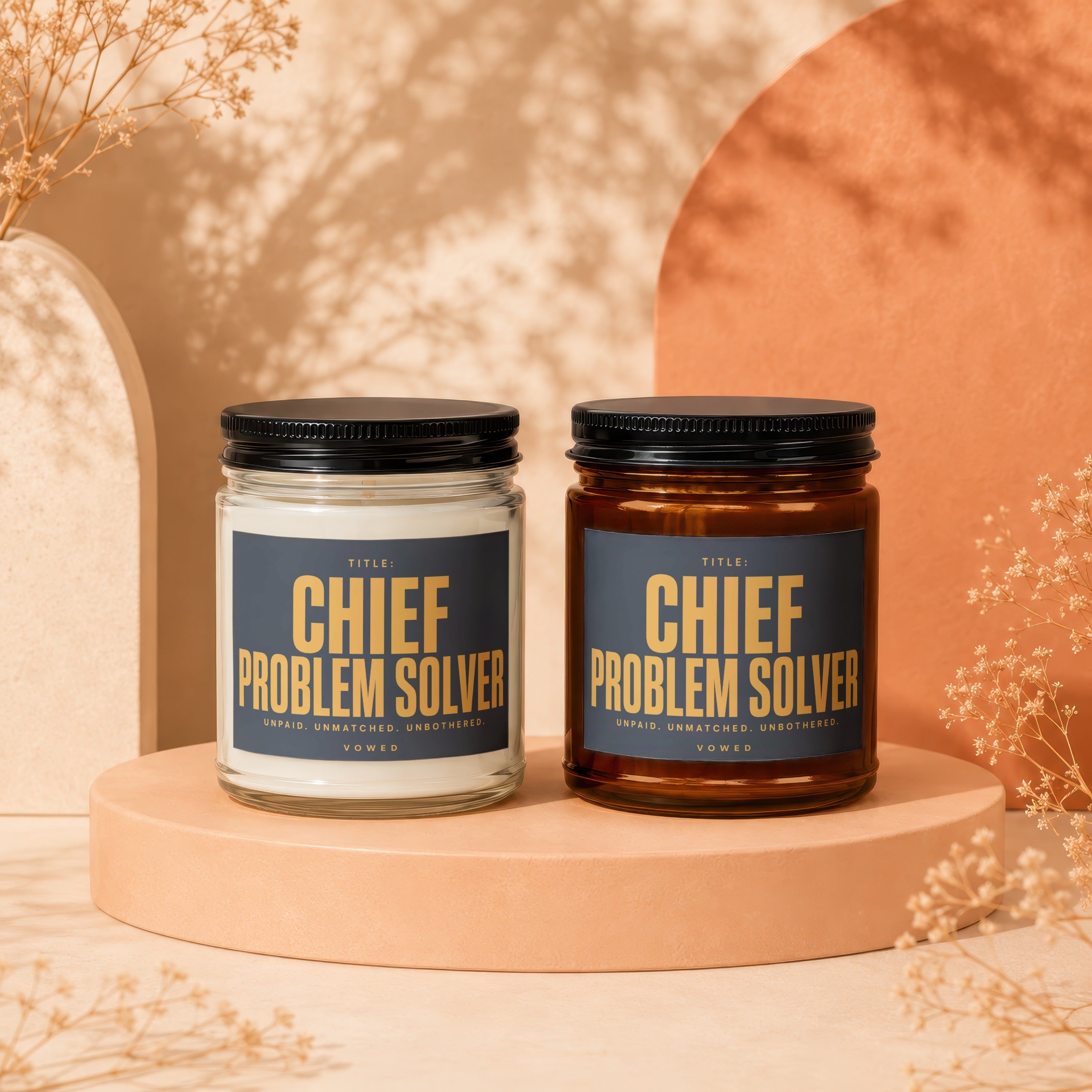 Two candles labeled "Chief Problem Solver" sit on a pedestal.