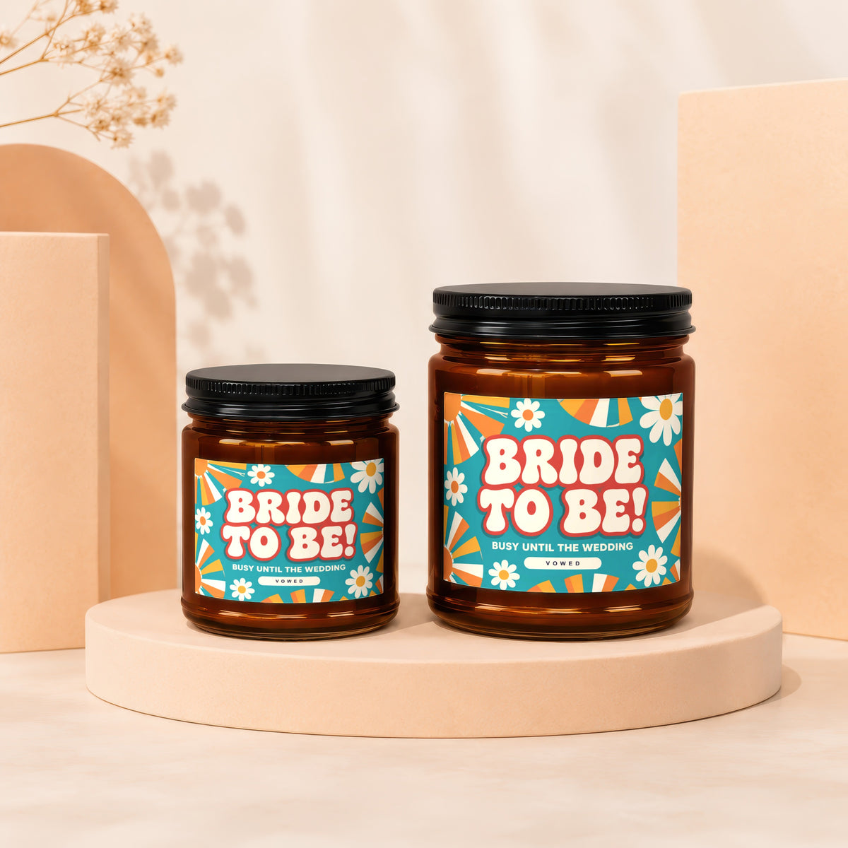 Two brown glass candles labeled "Bride To Be! Busy Until The Wedding".