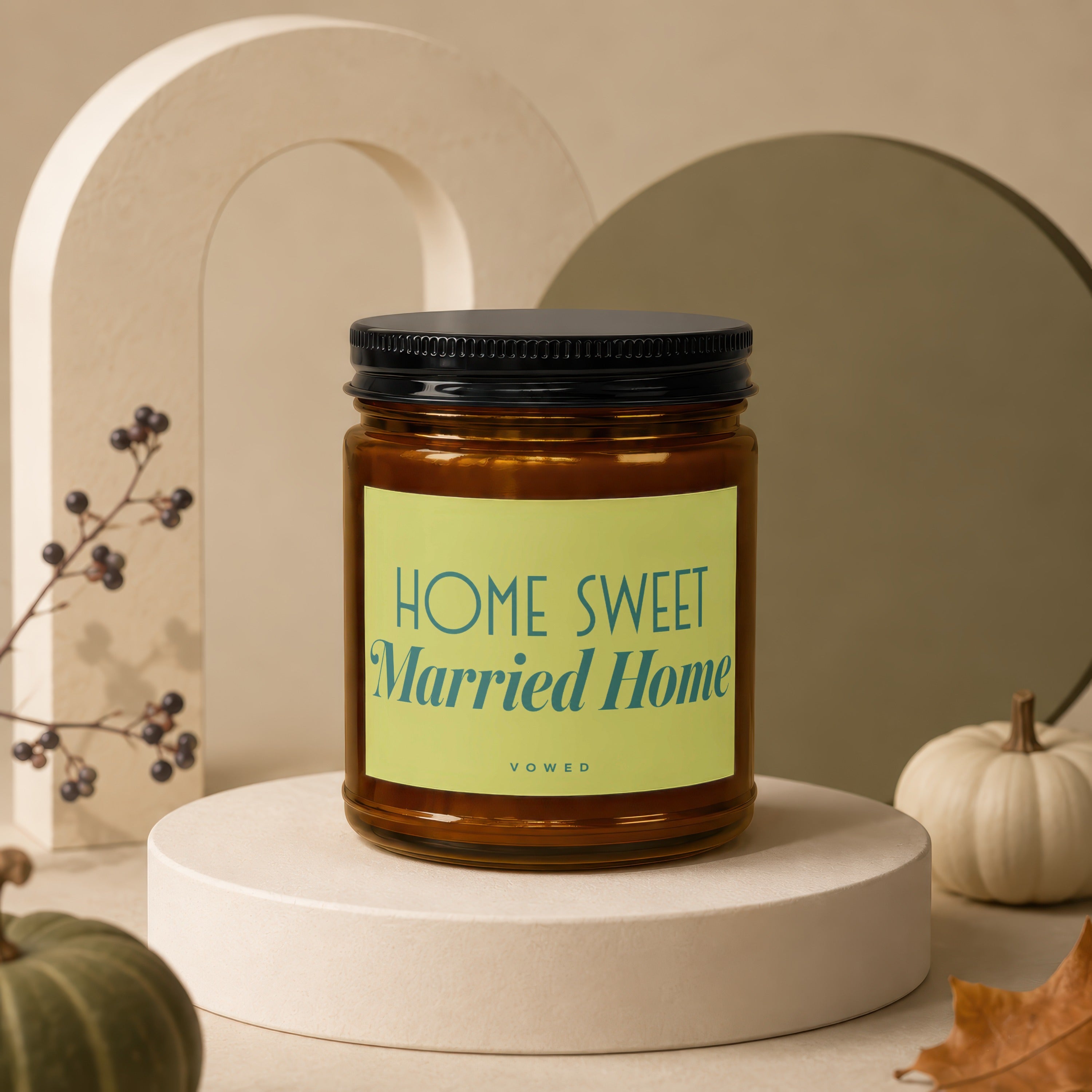 Amber jar candle with black lid labeled "HOME SWEET Married Home VOWED."