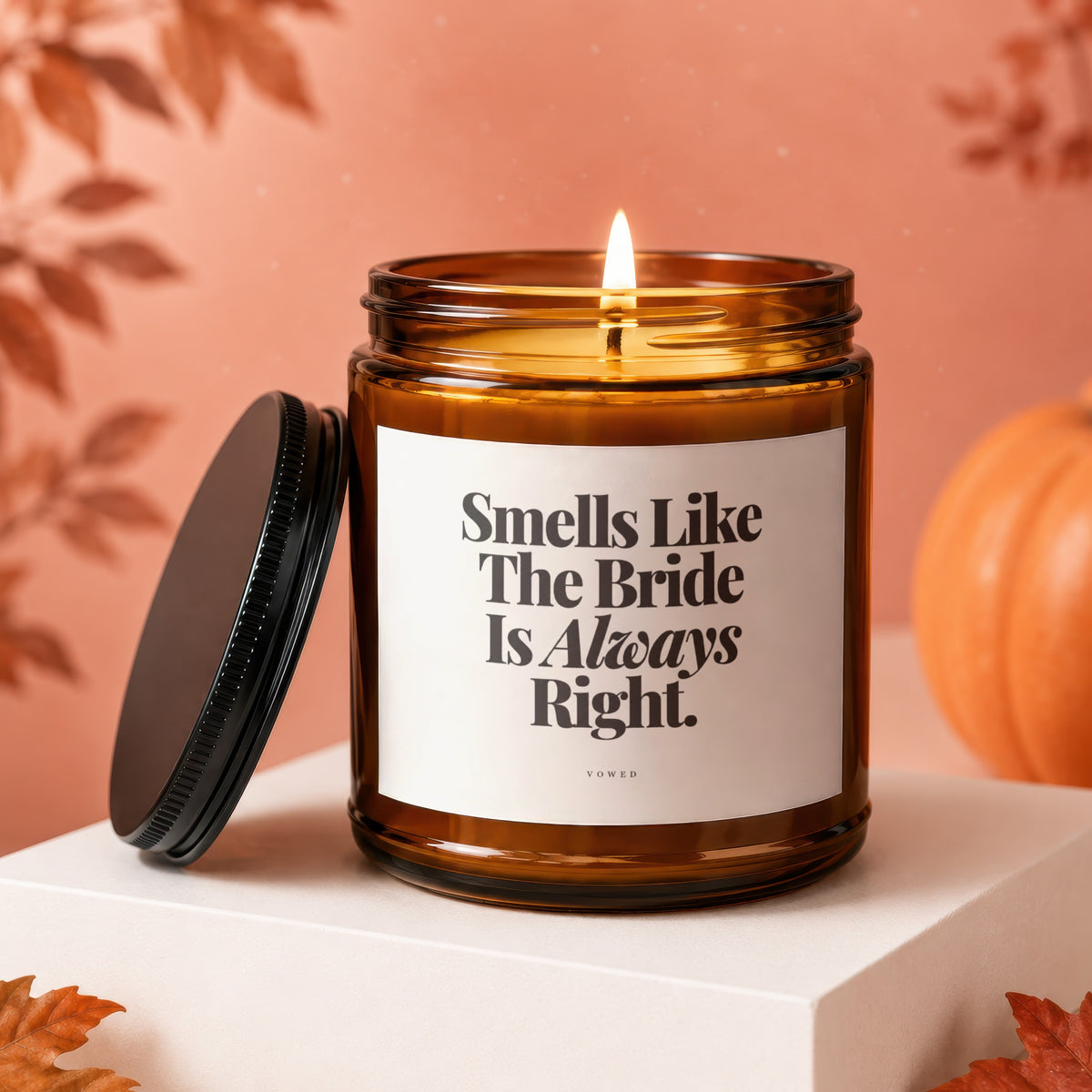 Amber jar candle with white label reading "Smells Like The Bride Is Always Right."