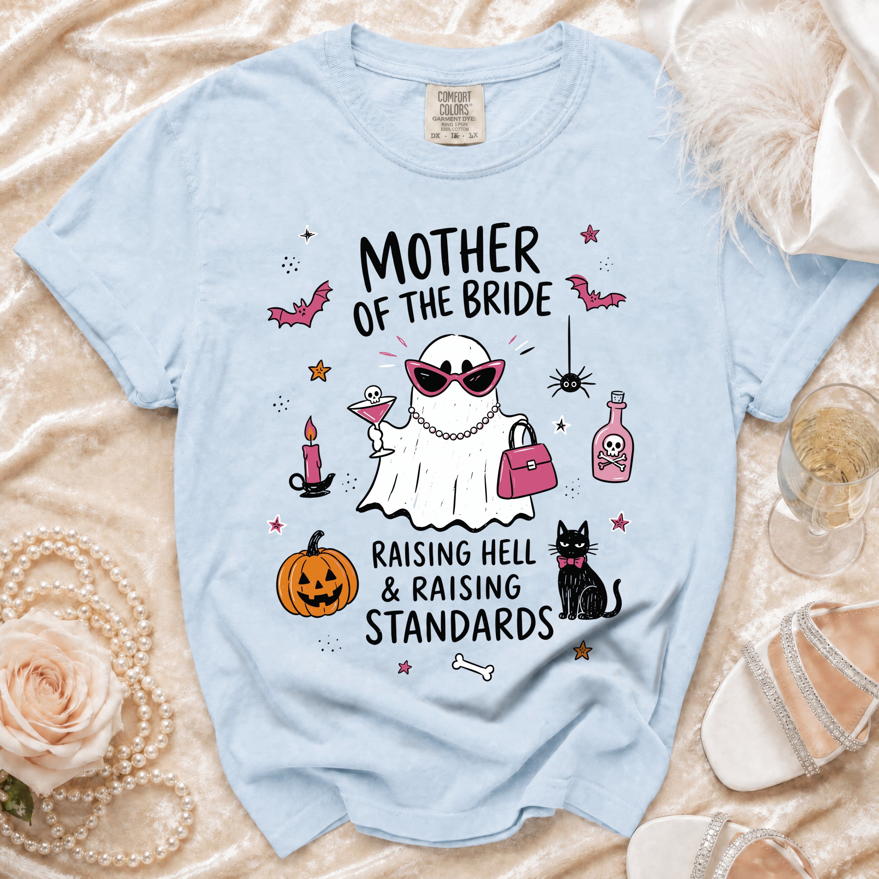Light blue t-shirt with "Mother of the Bride" text and a ghost graphic.