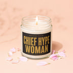 Jar candle with "Chief Hype Woman" text, petals scattered around.