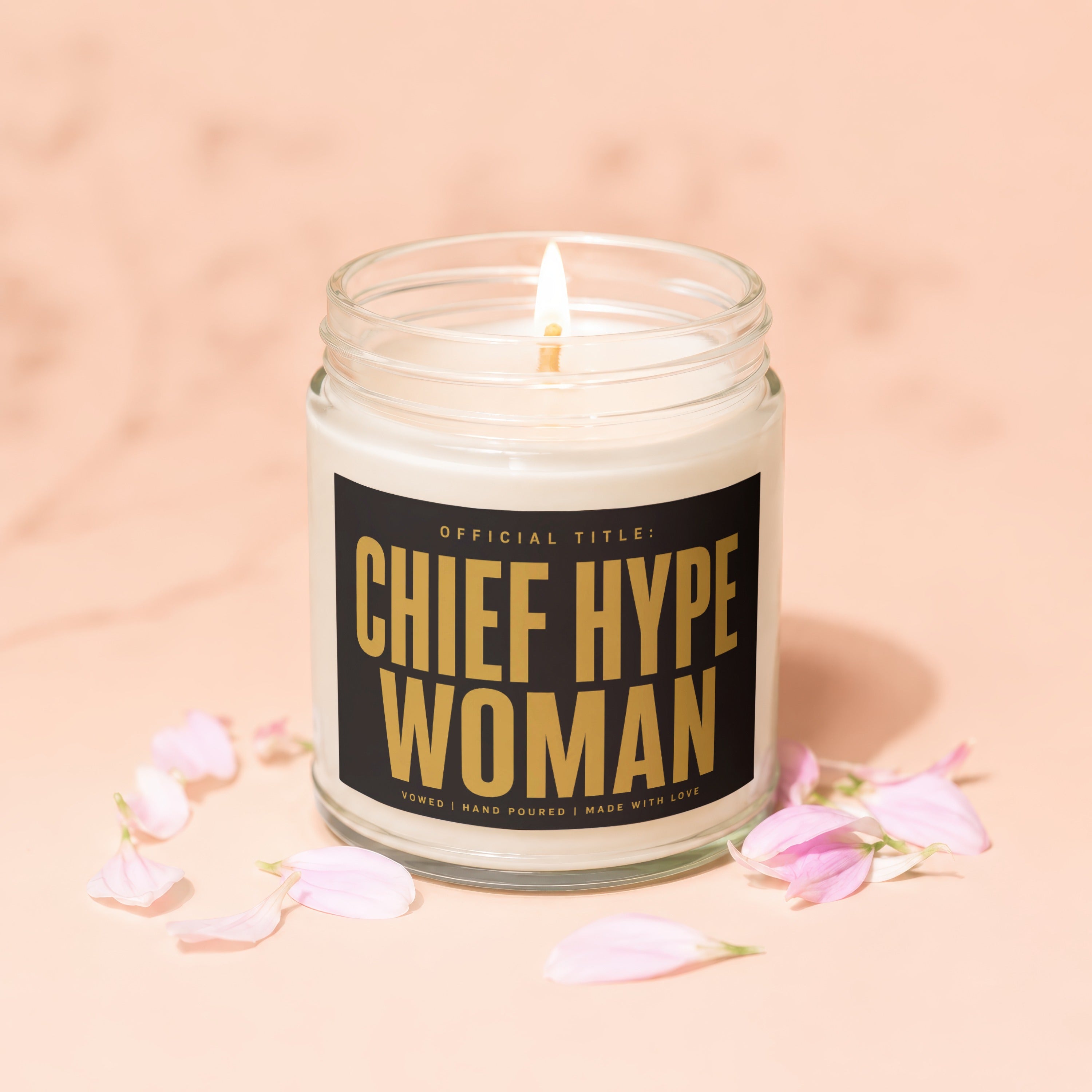 Jar candle with "Chief Hype Woman" text, petals scattered around.