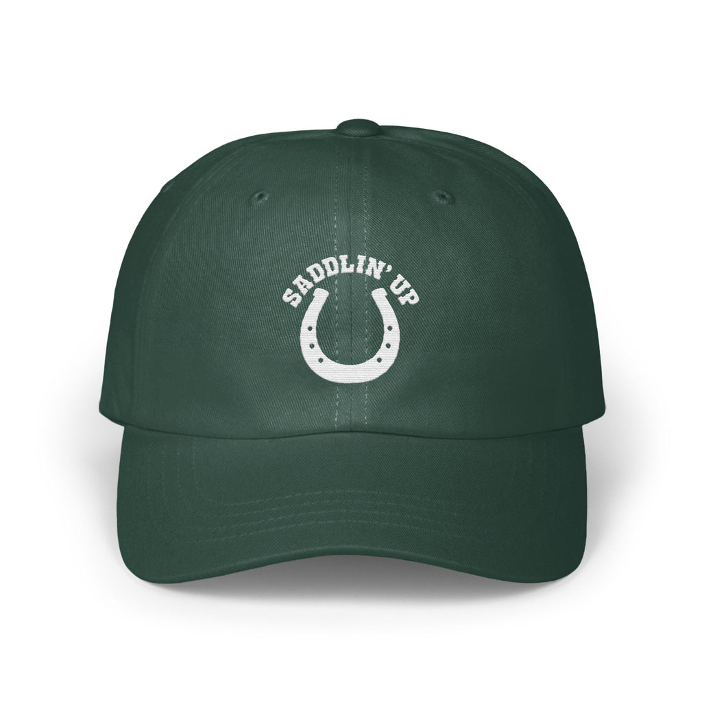 Dark green baseball cap with a white embroidered horseshoe and the text SADDLIN' UP.