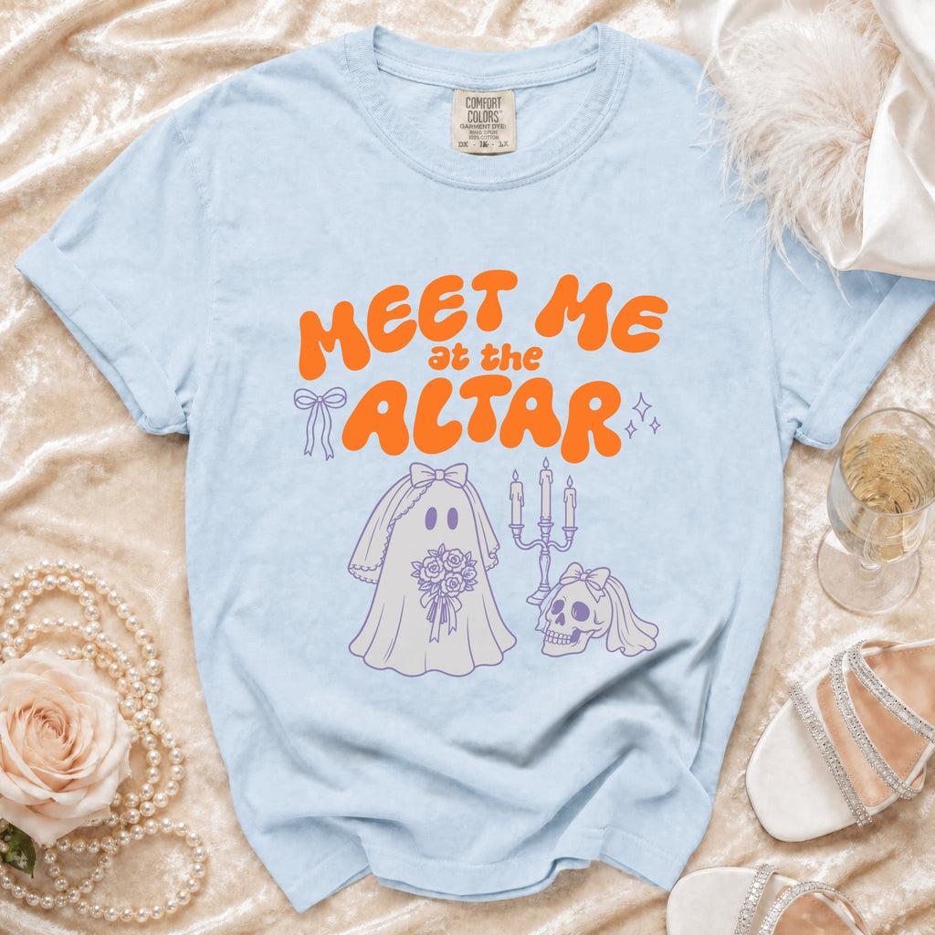 Light blue t-shirt with orange text "MEET ME at the ALTAR" and ghost bride illustration.