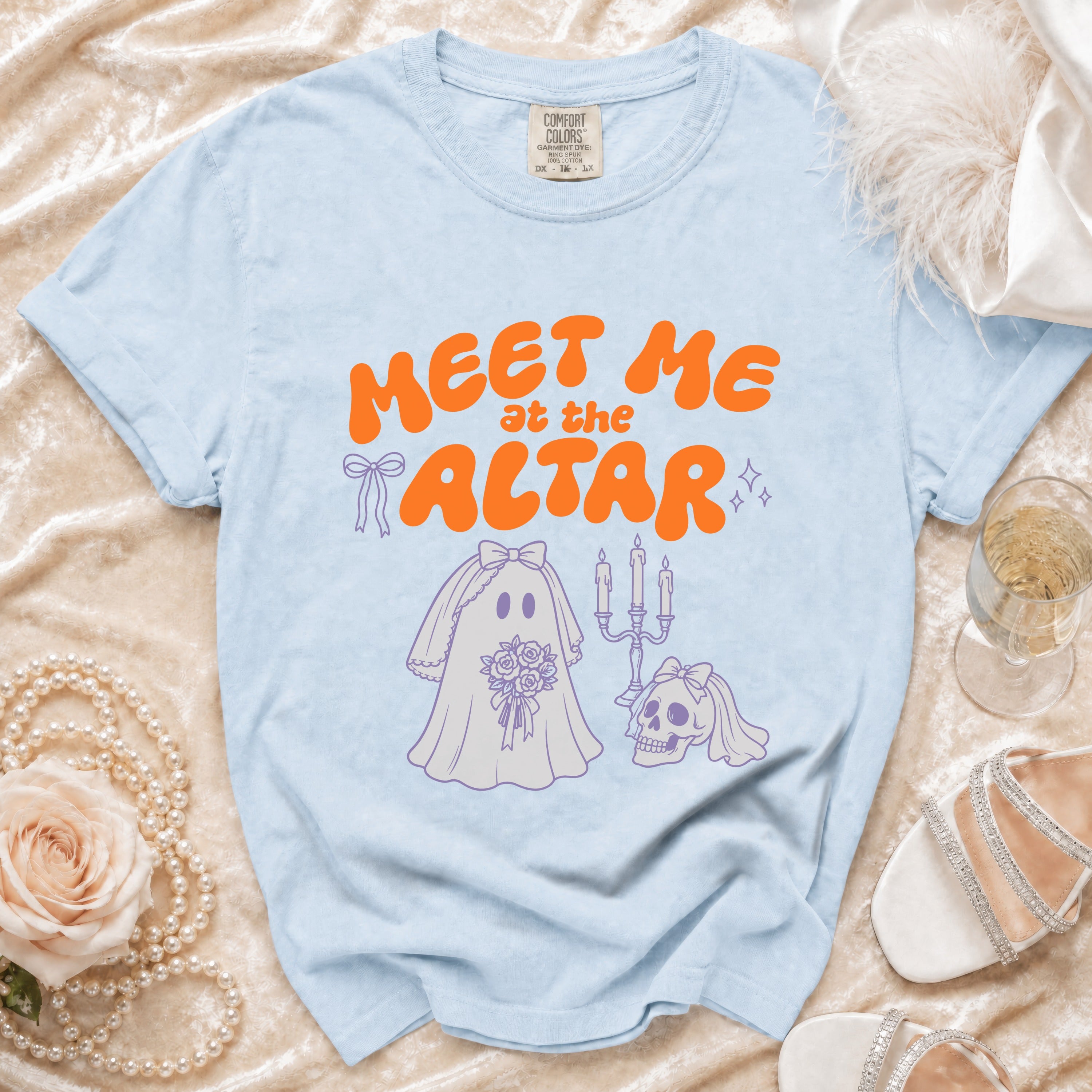 Light blue t-shirt with orange text "MEET ME at the ALTAR" and ghost bride illustration.