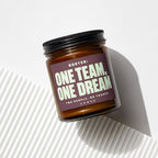 Amber glass jar with black lid, labeled "ROSTER: ONE TEAM, ONE DREAM".
