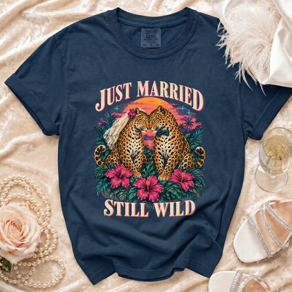 Navy t-shirt with "Just Married Still Wild" text and two leopards on a tropical sunset background.