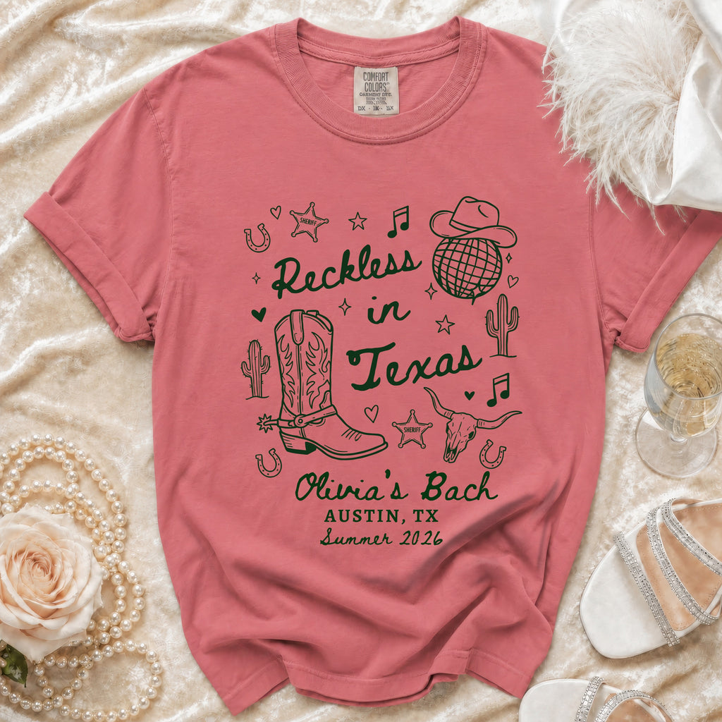 Coral t-shirt with "Reckless in Texas" and "Olivia's Bach" designs.