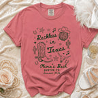 Coral t-shirt with "Reckless in Texas" and "Olivia's Bach" designs.