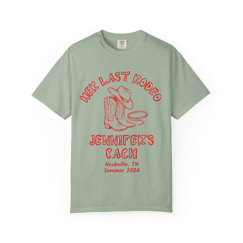 Sage green t-shirt with "Her Last Rodeo Jennifer's Bach Nashville Summer 2026" text.