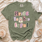 Olive green t-shirt with "Bride to Boo-tiful" text and ghost graphic.